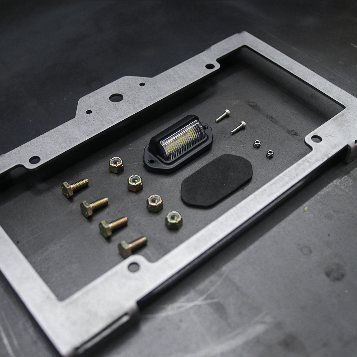 Metal License Plate Frame Weld on Close Up Hardware